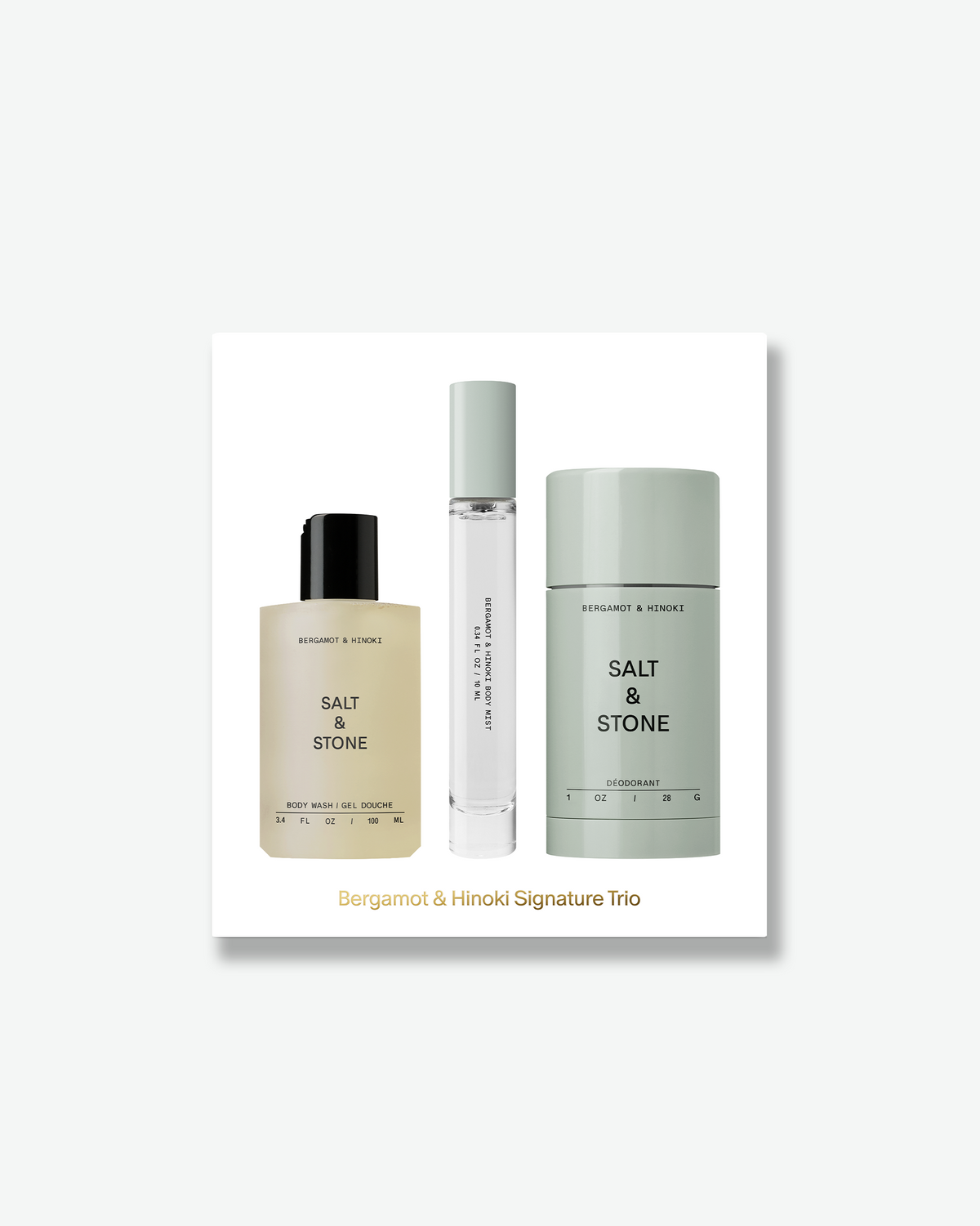 SALT & STONE Bergamot & Hinoki Signature Trio gift set featuring body wash, body mist, and deodorant displayed on a white gift box with gold lettering.