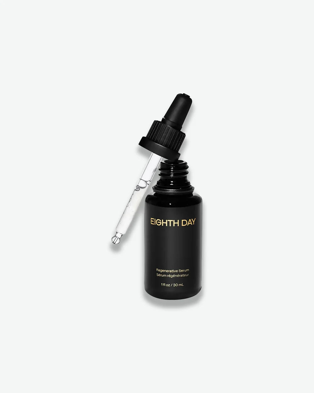Eighth Day Regenerative Serum in a black dropper bottle with gold lettering.