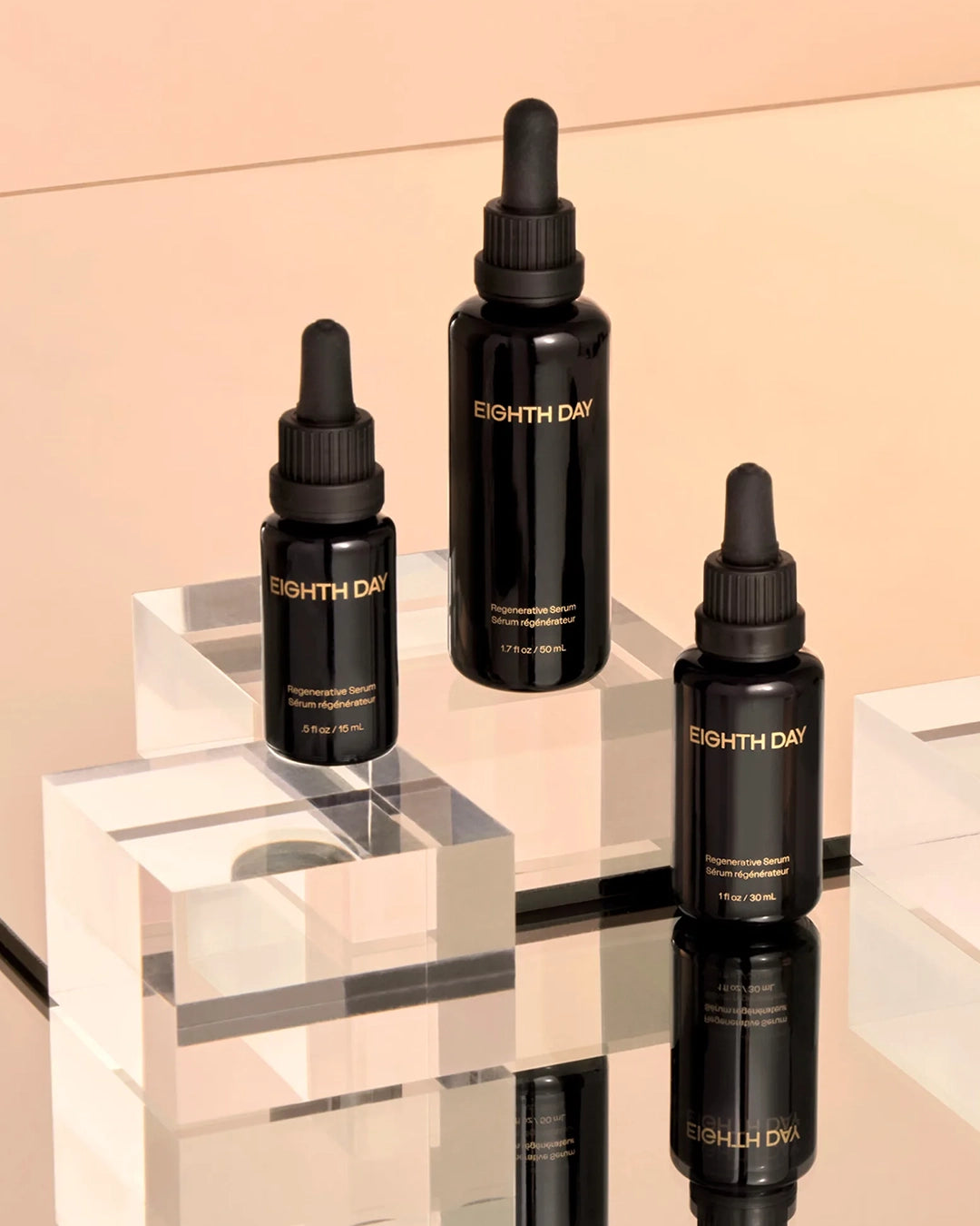 Three black 'Eighth Day' skincare bottles on a reflective surface with a beige background