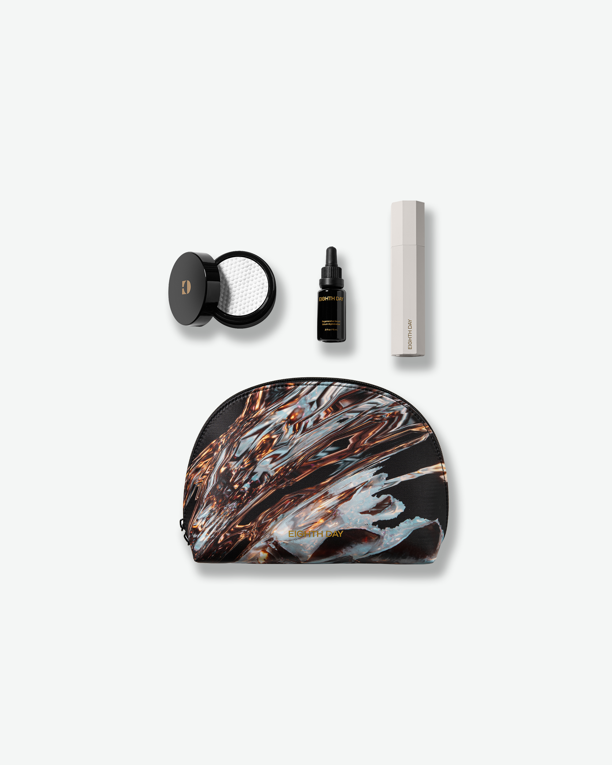 A curated Eighth Day skincare set featuring a jar of tonic pads, a serum dropper bottle, a white primer tube, and a black zippered travel pouch with a fluid bronze and blue design.