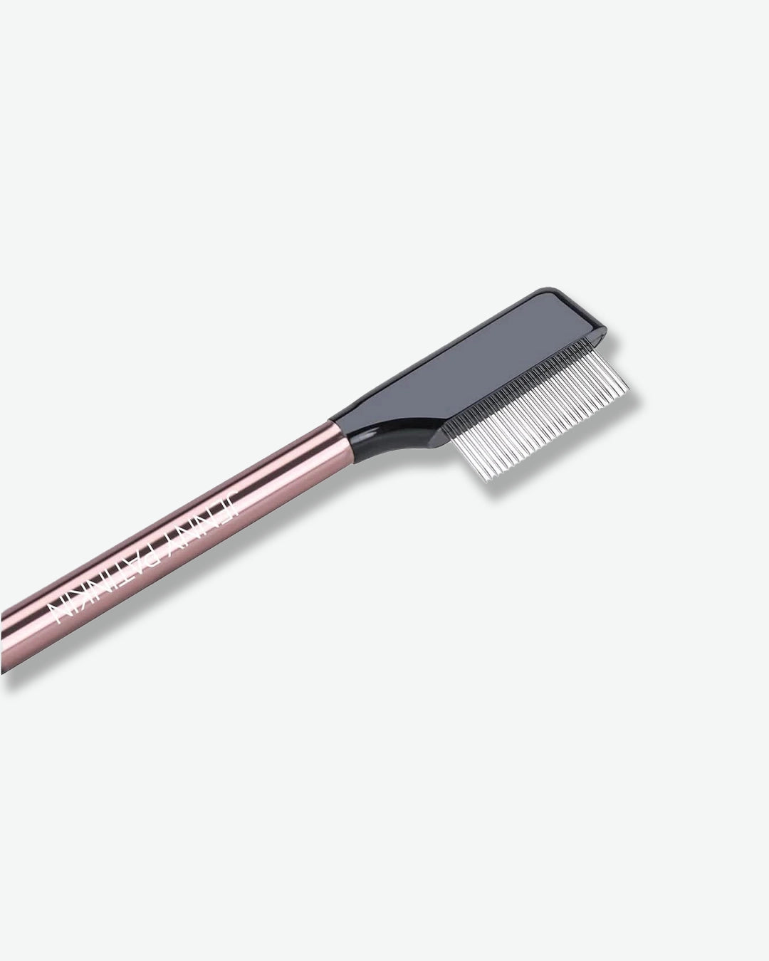 Eyebrow brush with rose gold handle on a white background