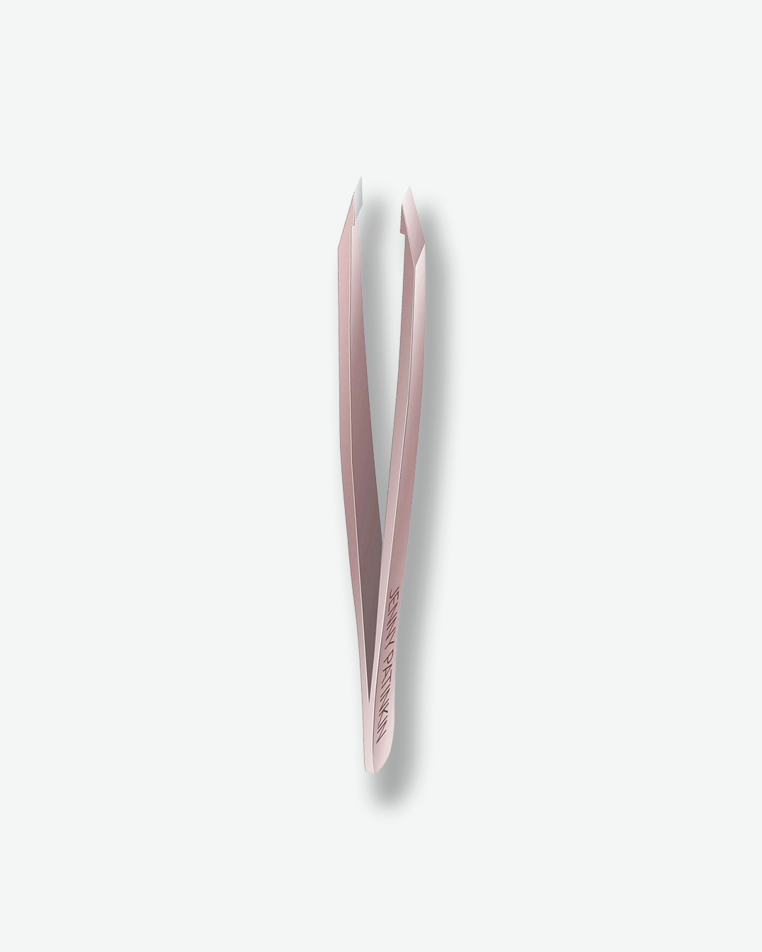 Pink tweezers on a white background
