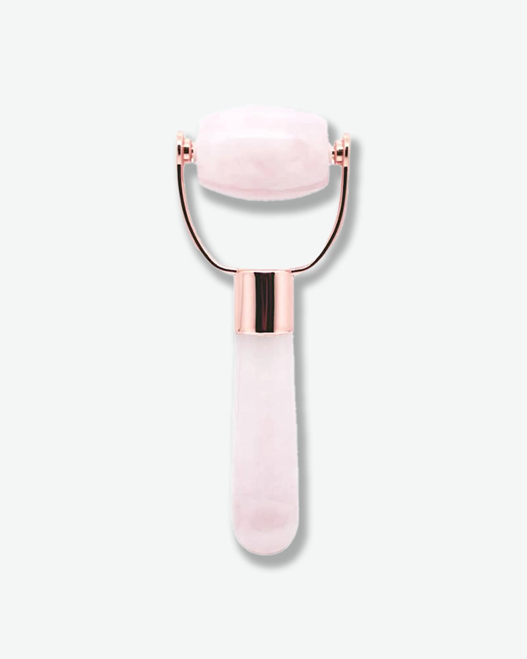 Pink facial roller with rose gold accents on a white background