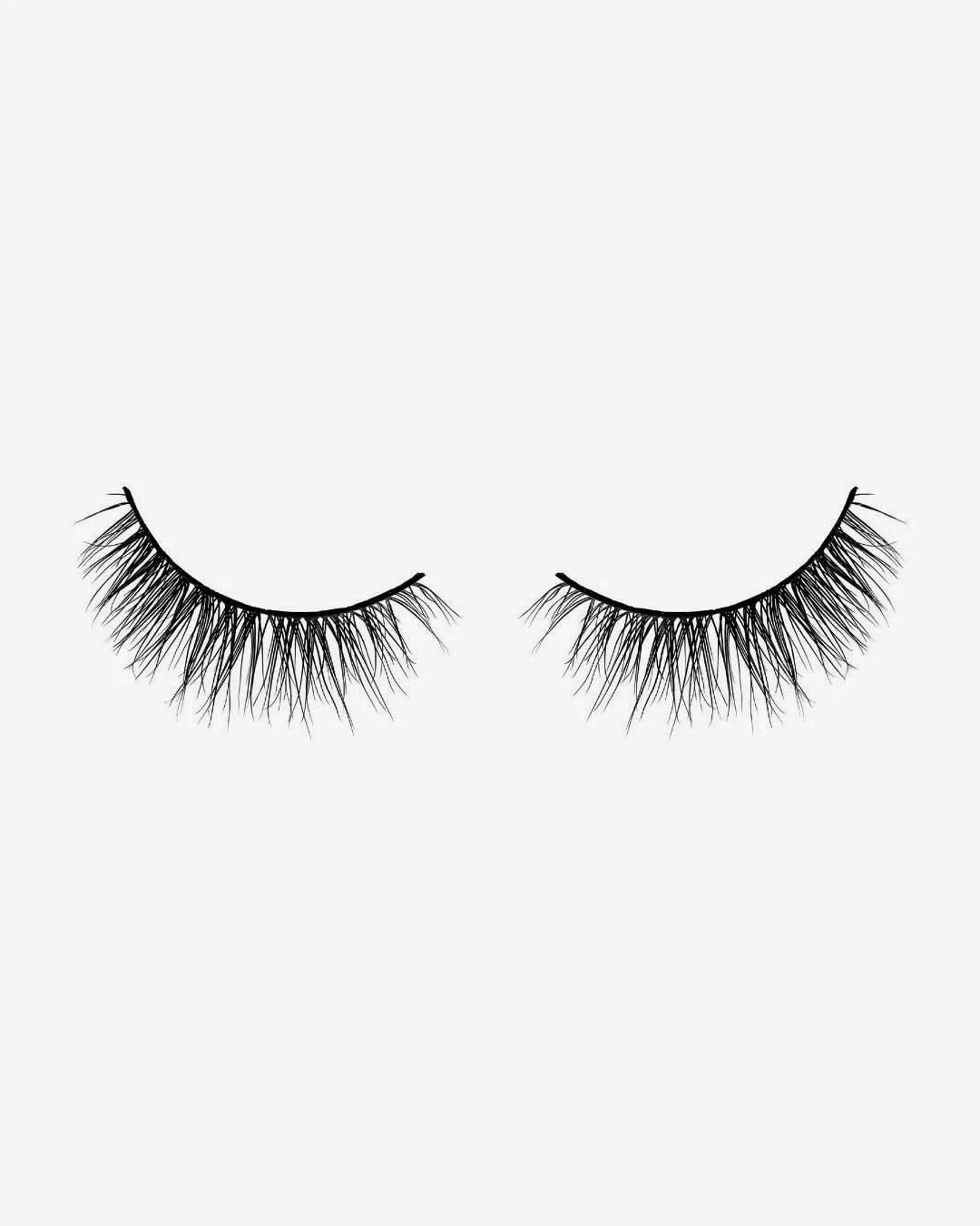 Pair of false eyelashes on a white background