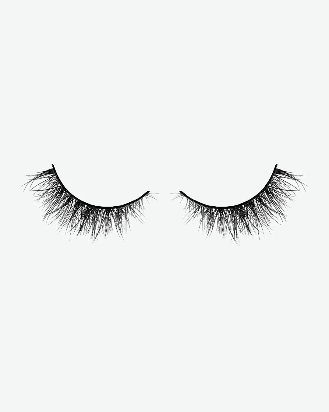 Pair of false eyelashes on a white background