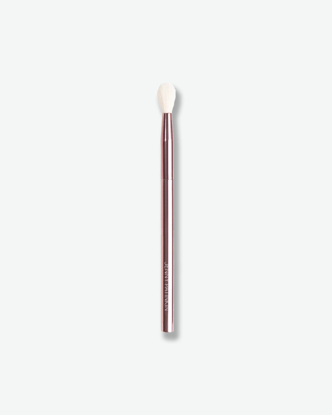 A fluffy eye makeup brush is displayed against a light gray background. The brush features a metallic rose-toned handle and soft white bristles with a tapered shape, designed for blending and diffusing eyeshadow seamlessly across the eyelid. Its sleek, professional design highlights precision and effortless application.