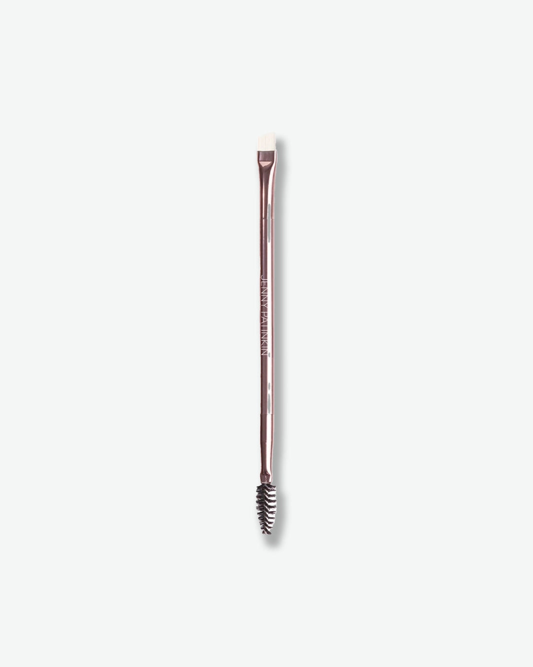 Rose gold makeup brush on a white background
