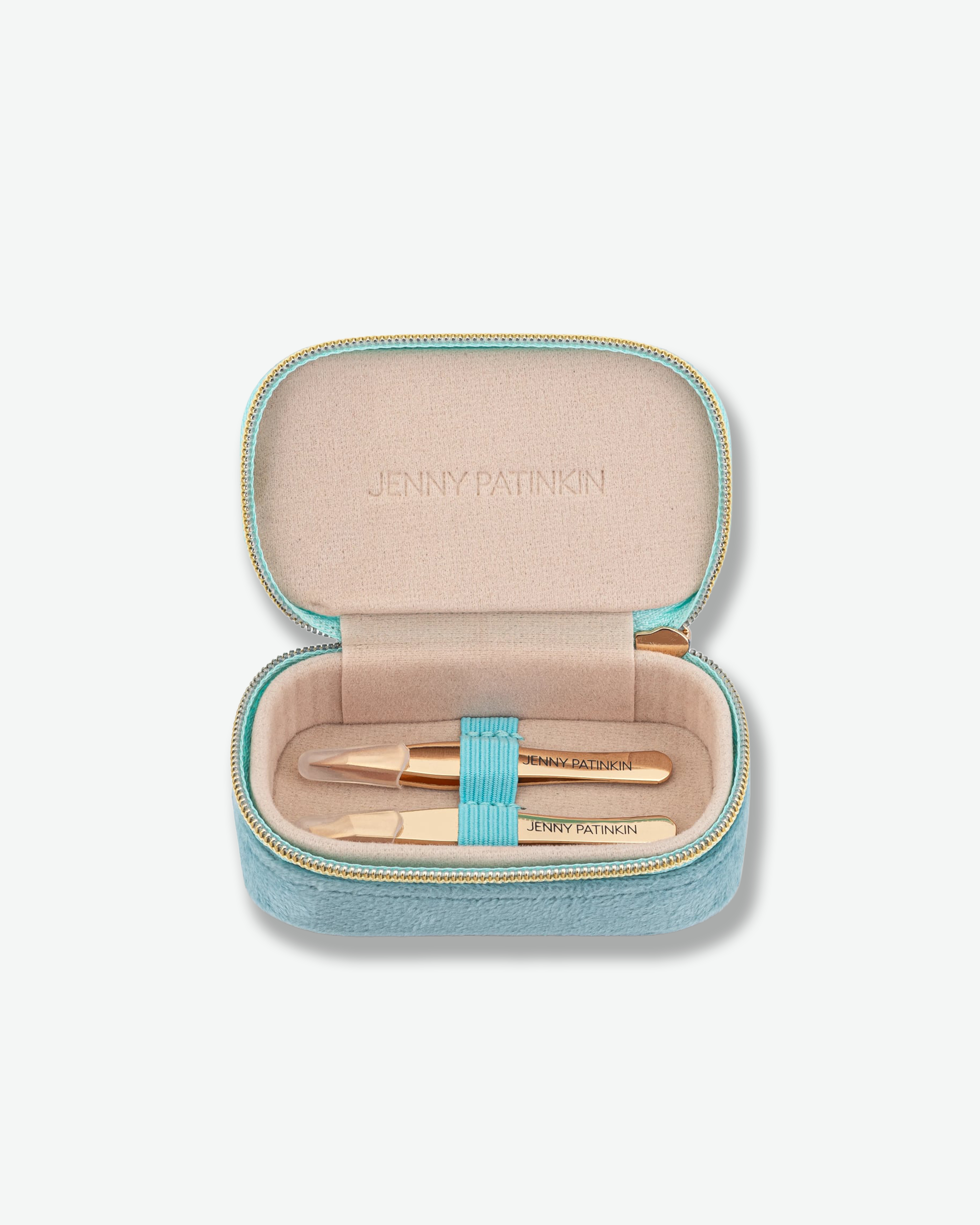 An open light blue textured zippered case with a beige interior, containing two gold cosmetic pens. The brand name 'JENNY PATINKIN' is embossed on the interior lid and printed on the pens.