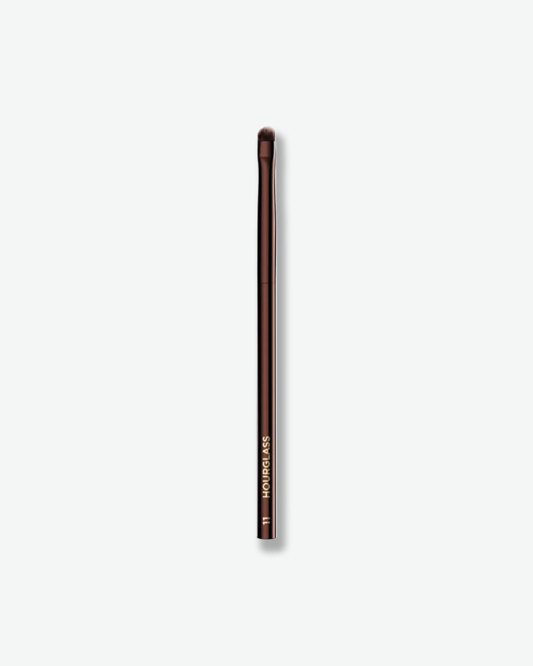 Metallic brush with a handle on a white background