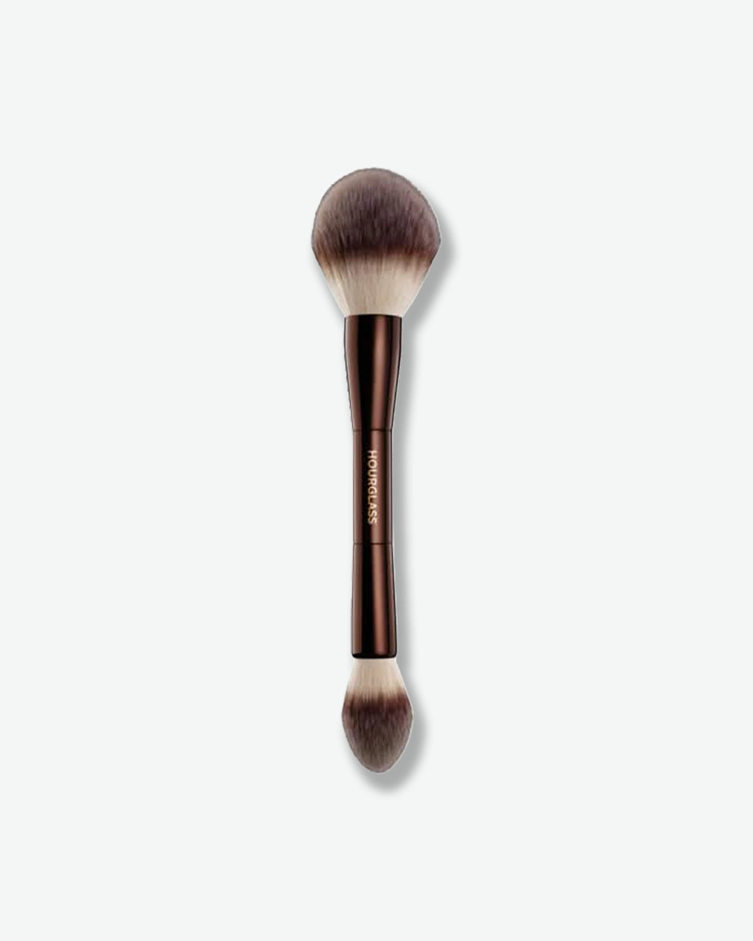Makeup brush with brown handle and bristles on a white background
