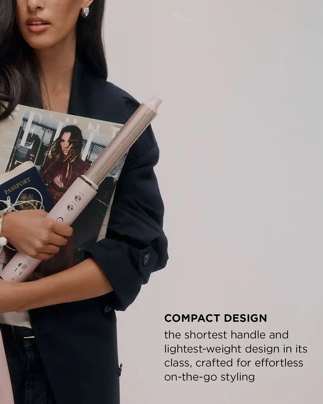 Person holding a hair straightener and magazine with text about compact design.