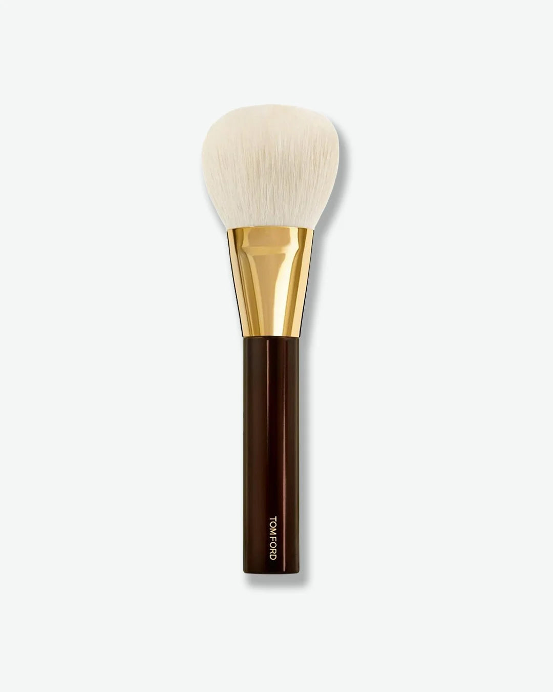 Makeup brush with gold ferrule and brown handle on a white background