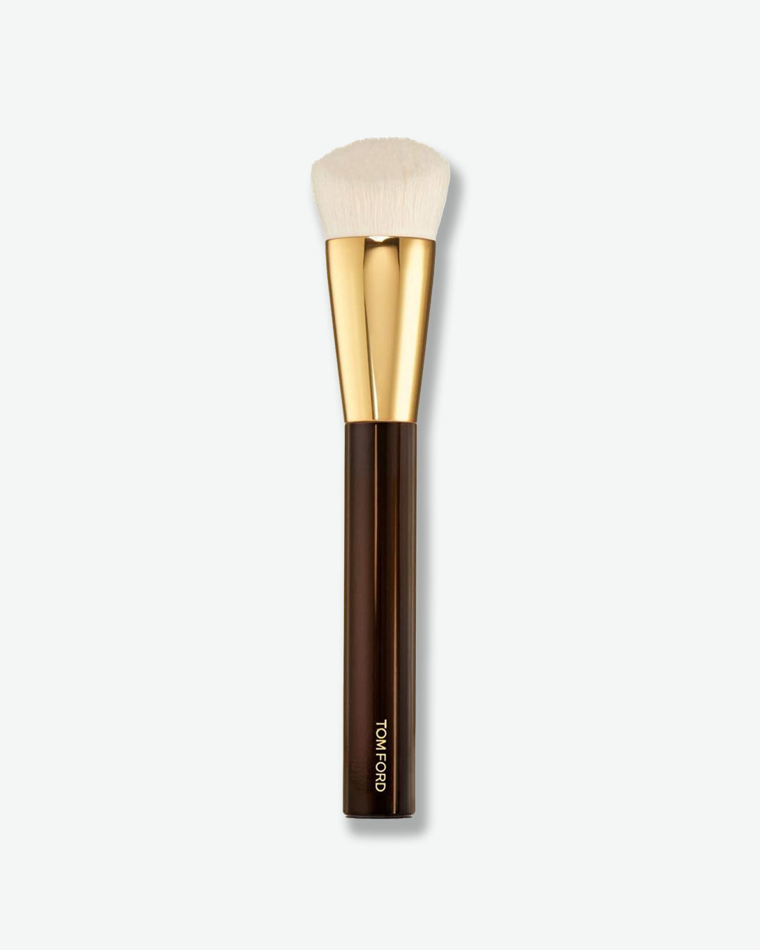 A makeup brush with soft, angled white bristles, a shiny gold ferrule, and a dark brown handle. The brush is designed for applying and blending face powders and is displayed vertically against a light gray background.