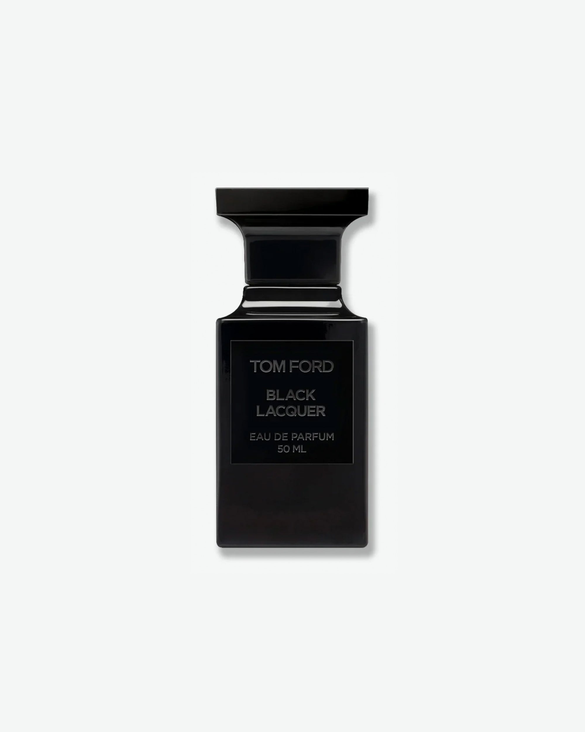 Product shot of Tom Ford Black Lacquer Eau de Parfum. The fragrance is housed in a 50ml sleek, architectural, glossy black bottle resembling a chess piece. It features a square black label with the brand name and fragrance details embossed in silver-grey text, casting a soft shadow against a solid light grey background.