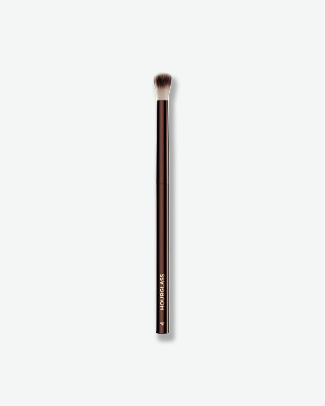 Makeup brush with brown bristle head on a white background
