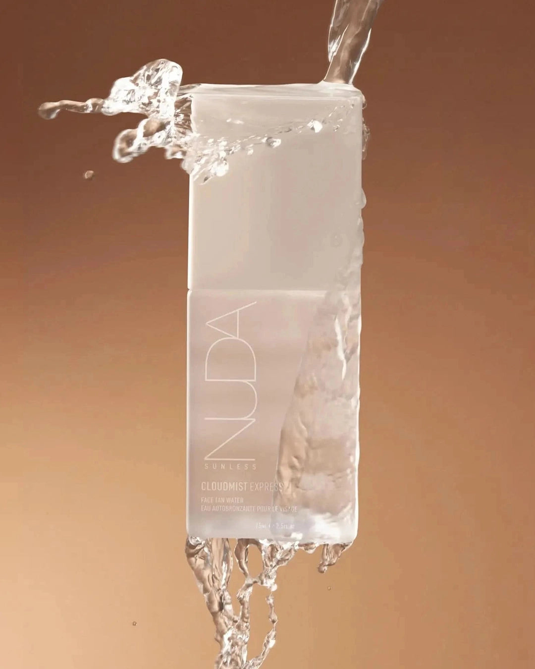 Nuda skincare product with water splashing around it on a gradient background