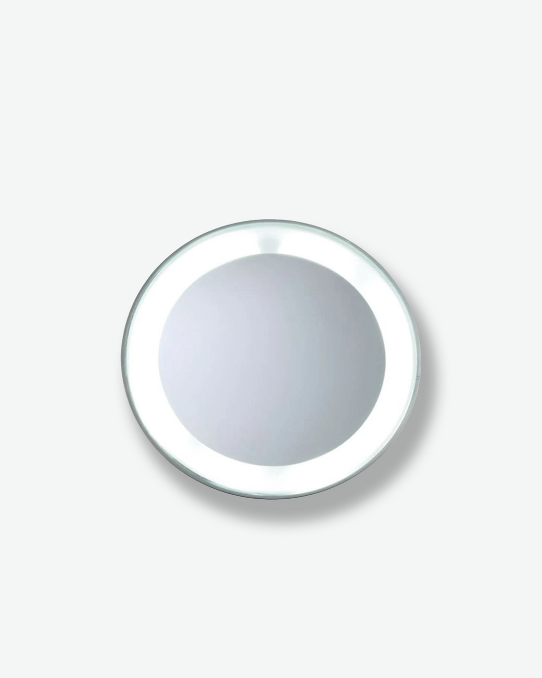 Front view of a circular, illuminated vanity mirror isolated against a plain gray background. The round mirror surface is bordered by a bright, even ring of integrated LED light.