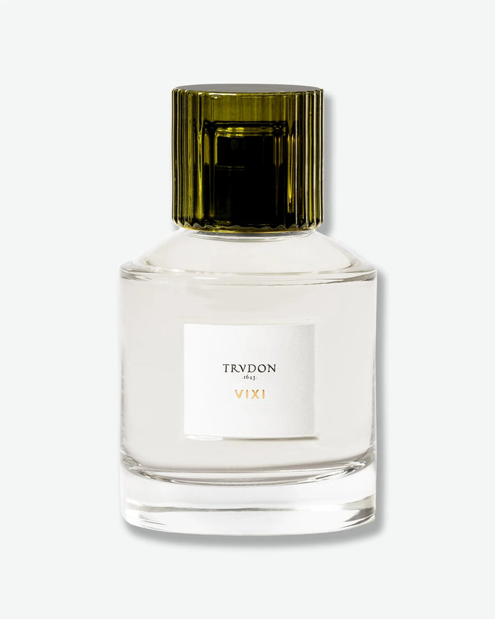 Clear glass Trudon VIXI eau de parfum bottle with a green glass lid on a white background