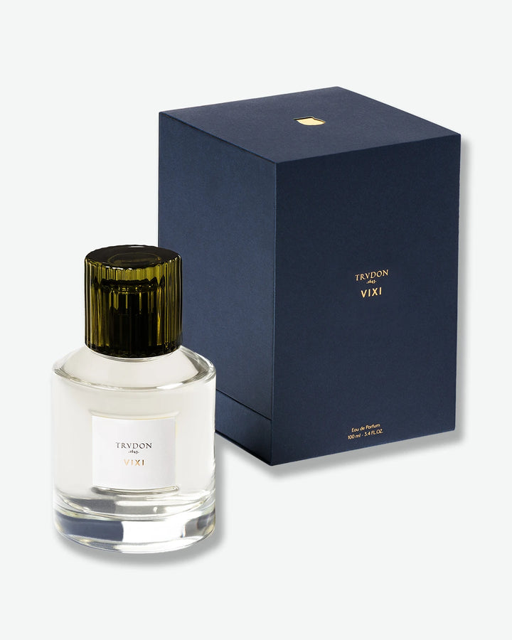 Perfume bottle with dark green cap and clear label next to a navy blue box with 'Trudon VIXI' branding on a white background.