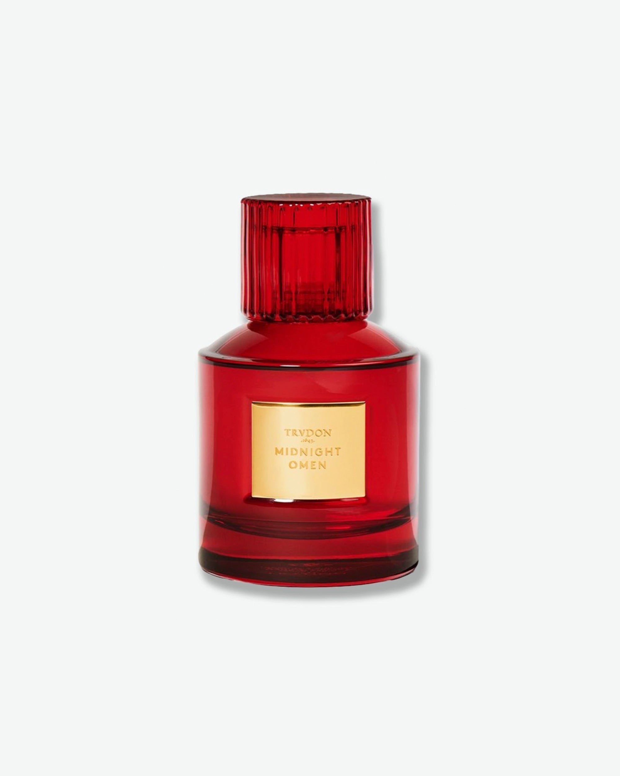 Red perfume bottle with gold label on a white background