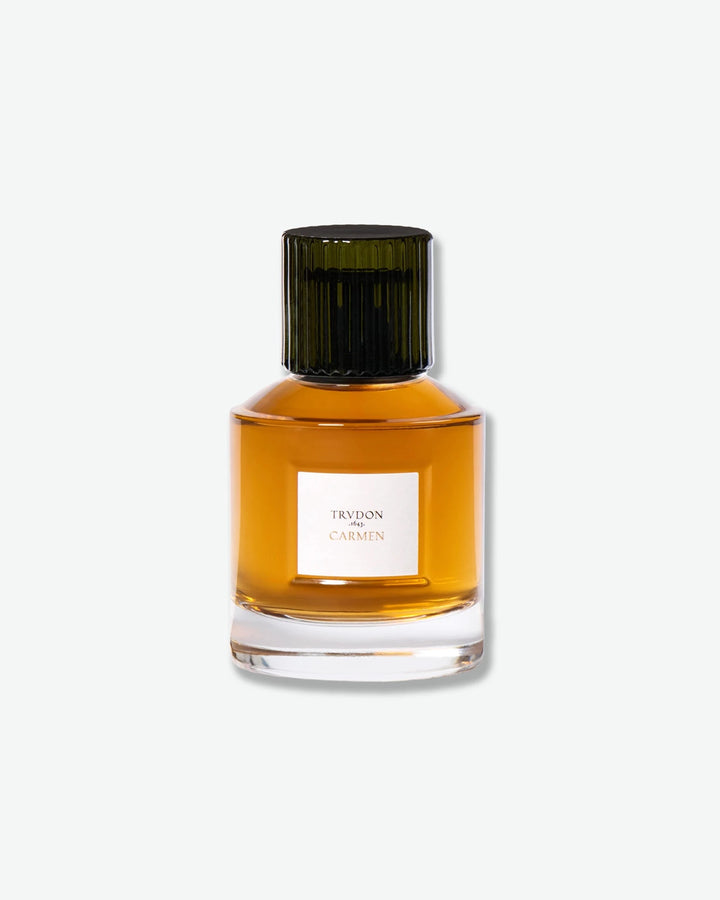 Perfume bottle with a green cap on a white background