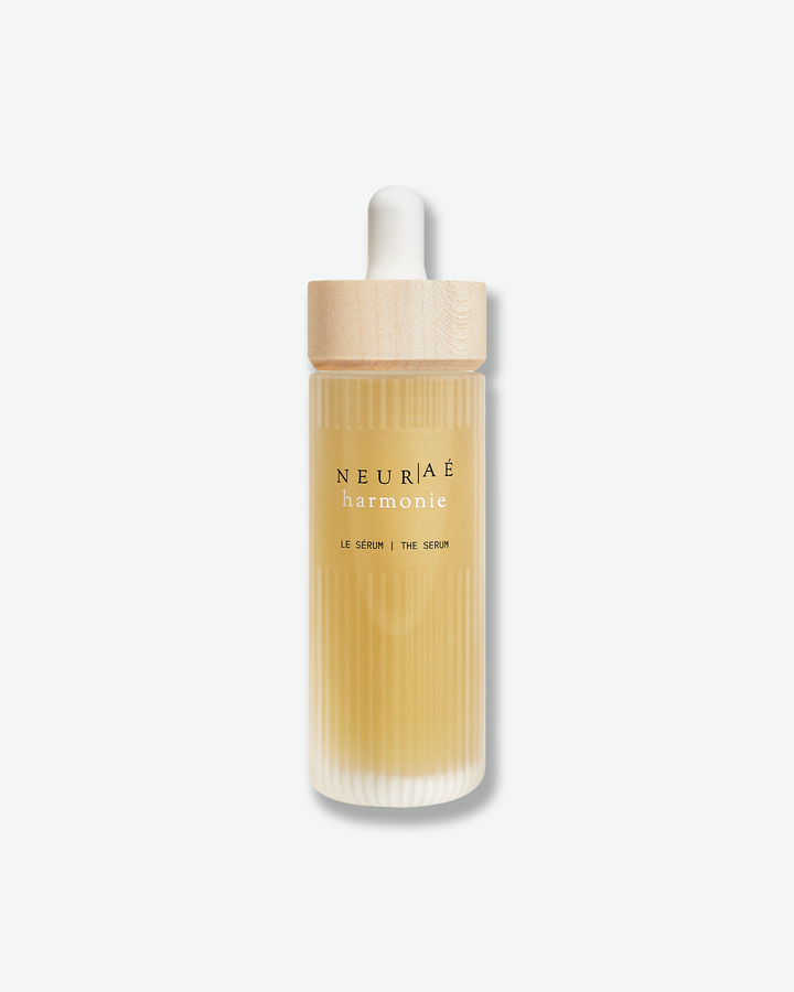 Neuriae serum bottle with wooden cap on a white background