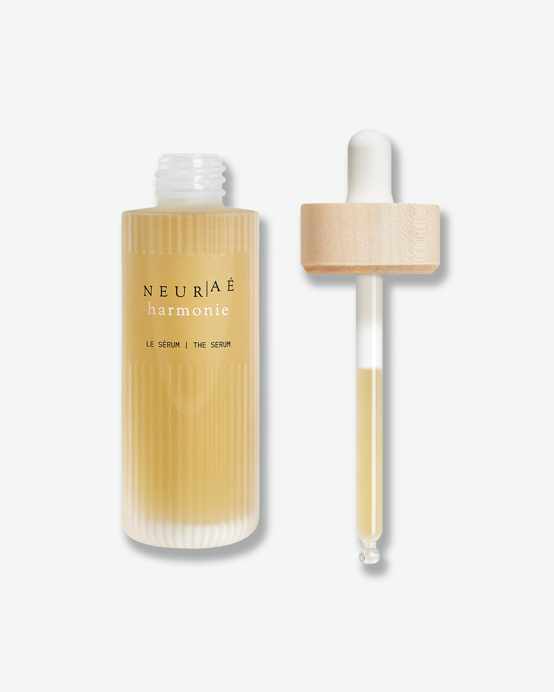 Neuriae skincare serum bottle with dropper on a white background