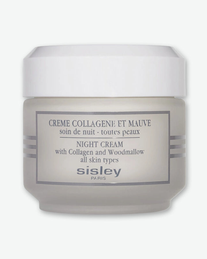 A frosted glass jar of Sisley Paris Night Cream with Collagen and Woodmallow, topped with a smooth white cap.