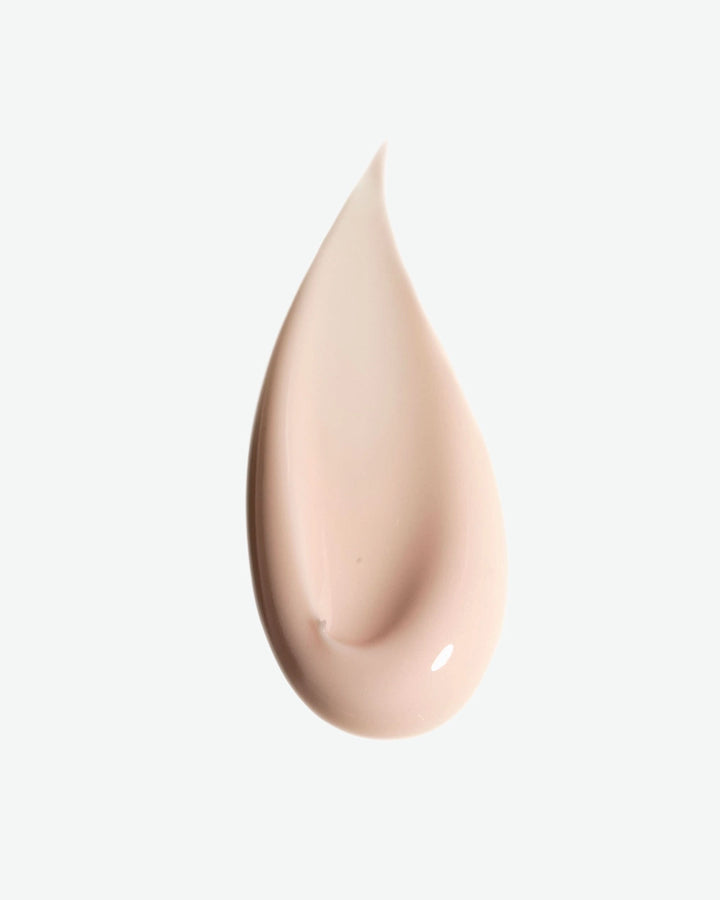 Beige droplet on a light gray background