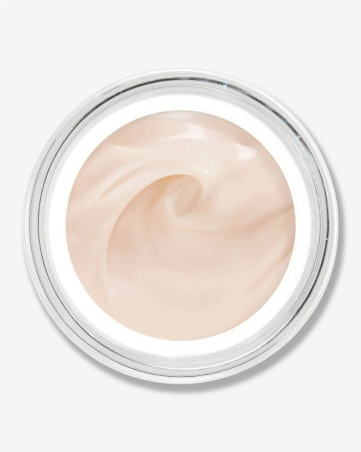 A top-down view looking into an open jar of Sisleÿa L'Intégral Anti-Âge Fresh Gel Cream, showcasing the smooth, pale peach-pink gel-cream texture swirled inside.