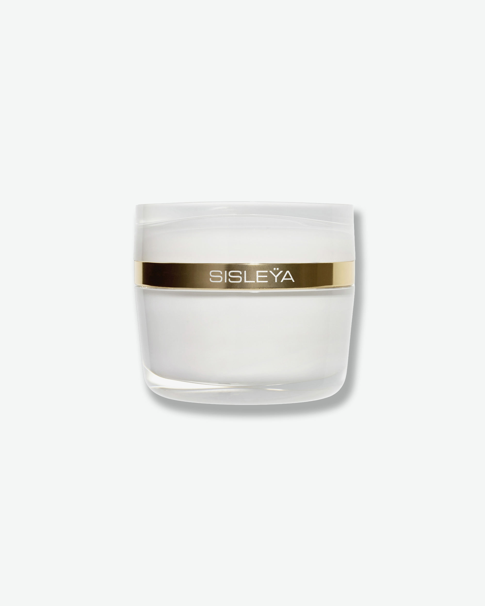 Front view of a Sisleÿa anti-aging cream jar by Sisley Paris against a plain gray background. The sleek, heavy-bottomed white glass jar features a reflective metallic gold accent ring running around its upper half with the "SISLEYÄ" brand name centered in white text.