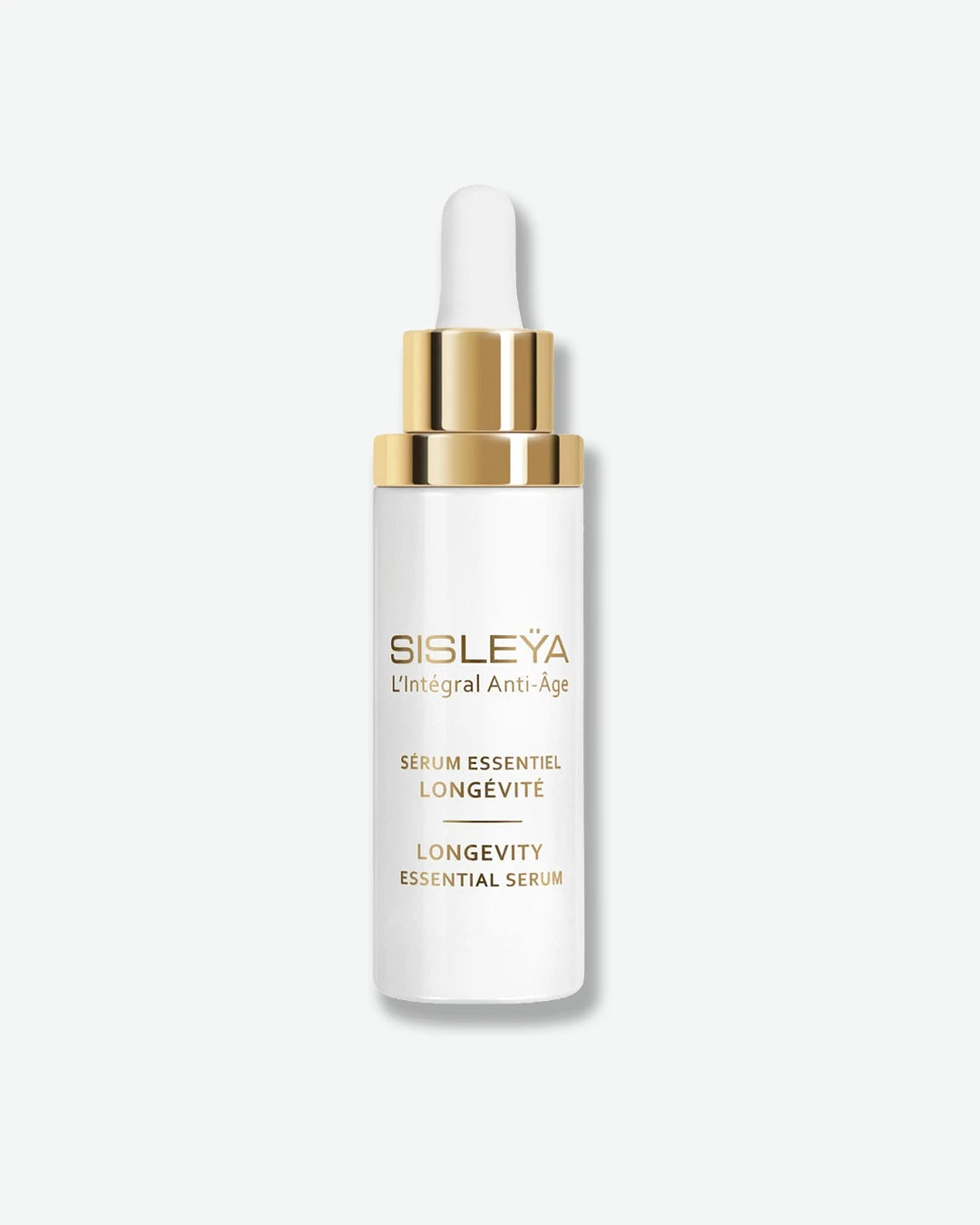 A glossy white dropper bottle of Sisley Paris Sisleÿa L'Intégral Anti-Âge Longevity Essential Serum, fitted with a metallic gold dropper collar and a white rubber bulb.