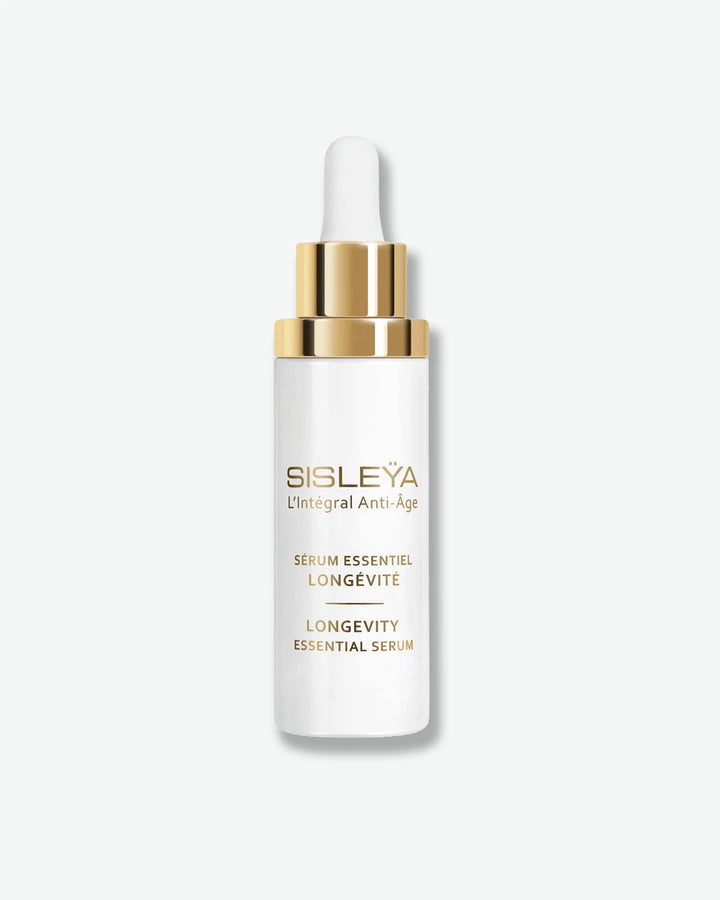 A glossy white dropper bottle of Sisley Paris Sisleÿa L'Intégral Anti-Âge Longevity Essential Serum, fitted with a metallic gold dropper collar and a white rubber bulb.