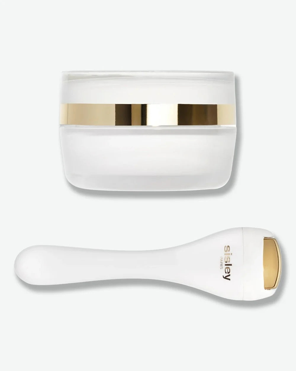 Sisleÿa L’Integral Anti-Age Eye and Lip Contour Cream with accompanying massage tool.