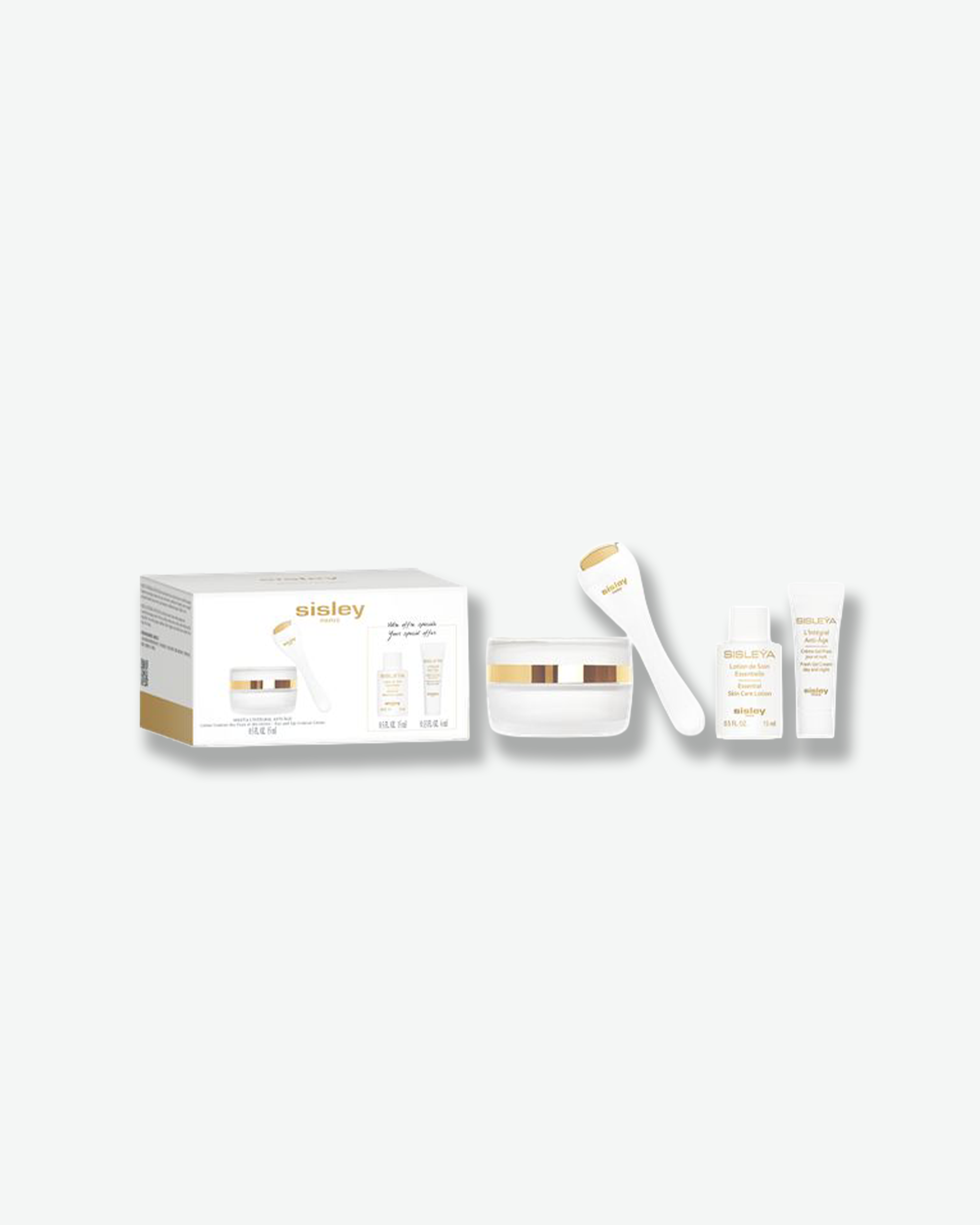 A Sisley Paris Sisleya skincare set arranged against a white background, including a box, cream jar with gold trim, facial roller, and two sample-sized bottles.