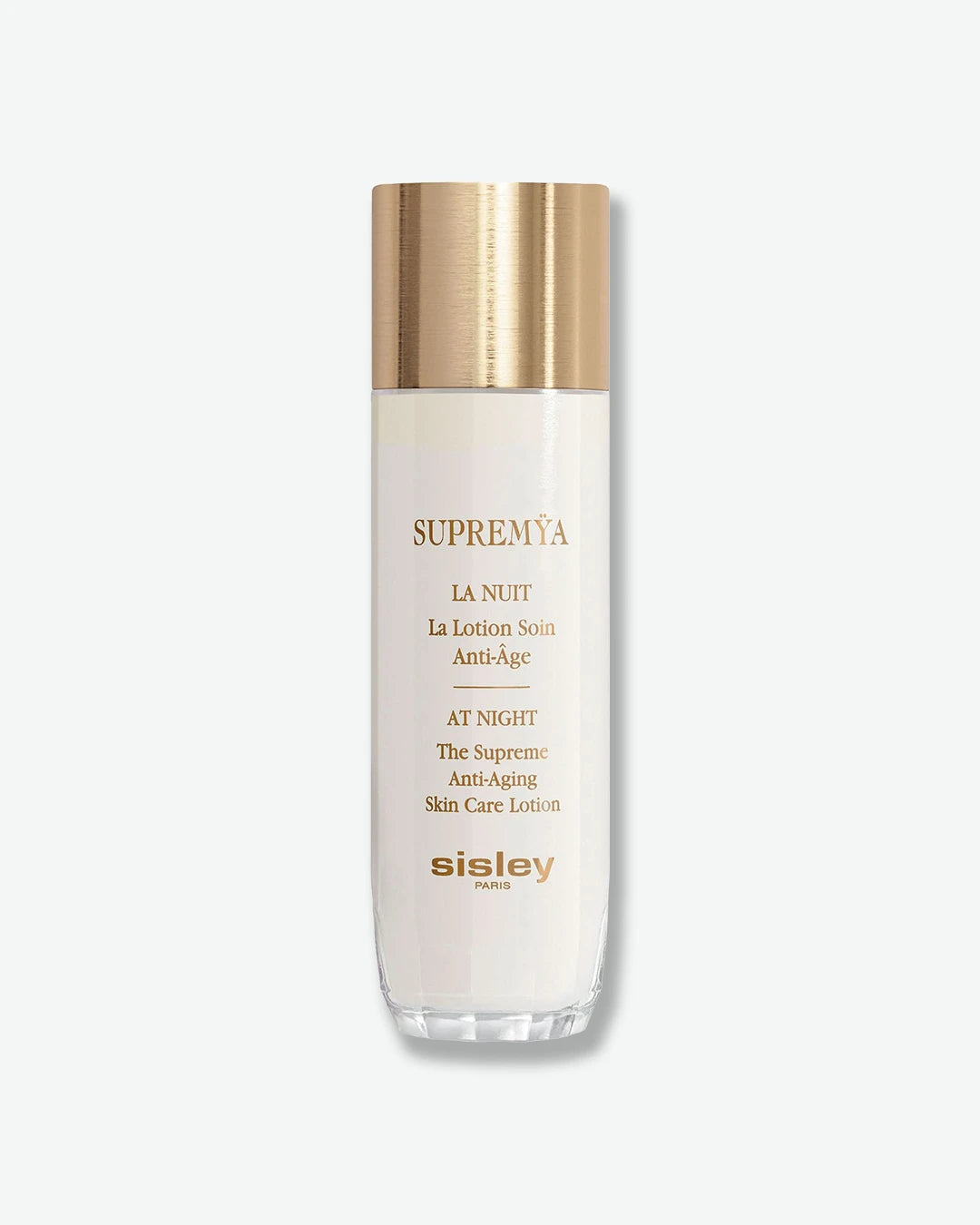 A tall, elegant white bottle of Sisley Paris Supremÿa At Night The Supreme Anti-Aging Skin Care Lotion, topped with a cylindrical brushed-gold cap.