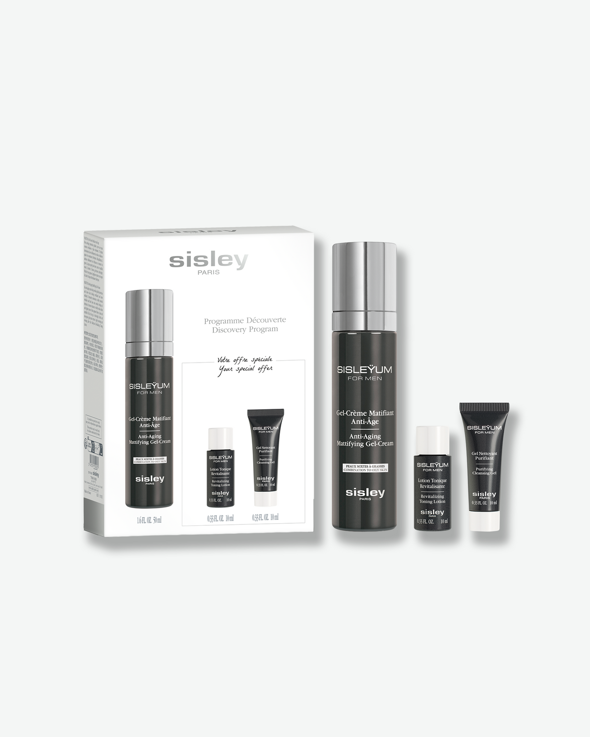 A Sisleyum Discovery Program set for men featuring dark gray skincare items—a tall pump bottle, mini lotion, and mini tube—displayed beside their white product box on a plain background.