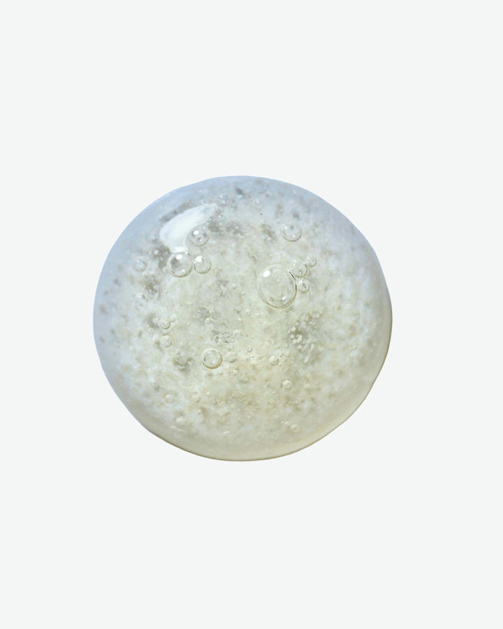 Clear gel-like substance with bubbles on a white background