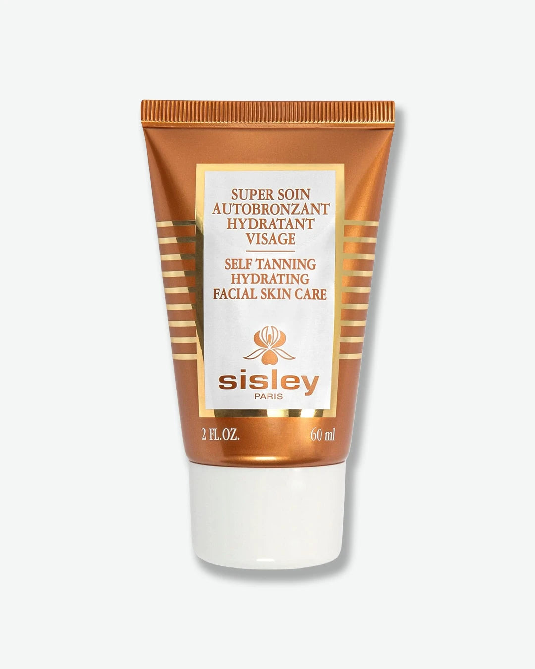 A metallic bronze squeeze tube of Sisley Paris Super Soin Autobronzant Hydratant Visage Self Tanning Hydrating Facial Skin Care, resting vertically on a plain white cap.