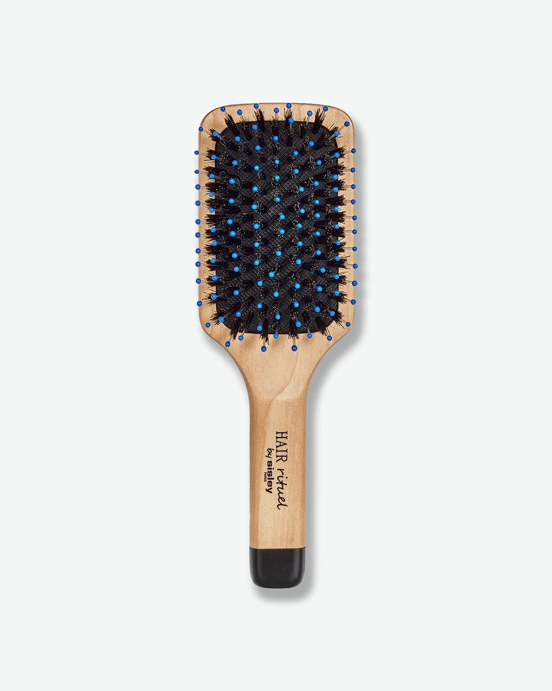 Wooden paddle hairbrush with black bristles on a white background