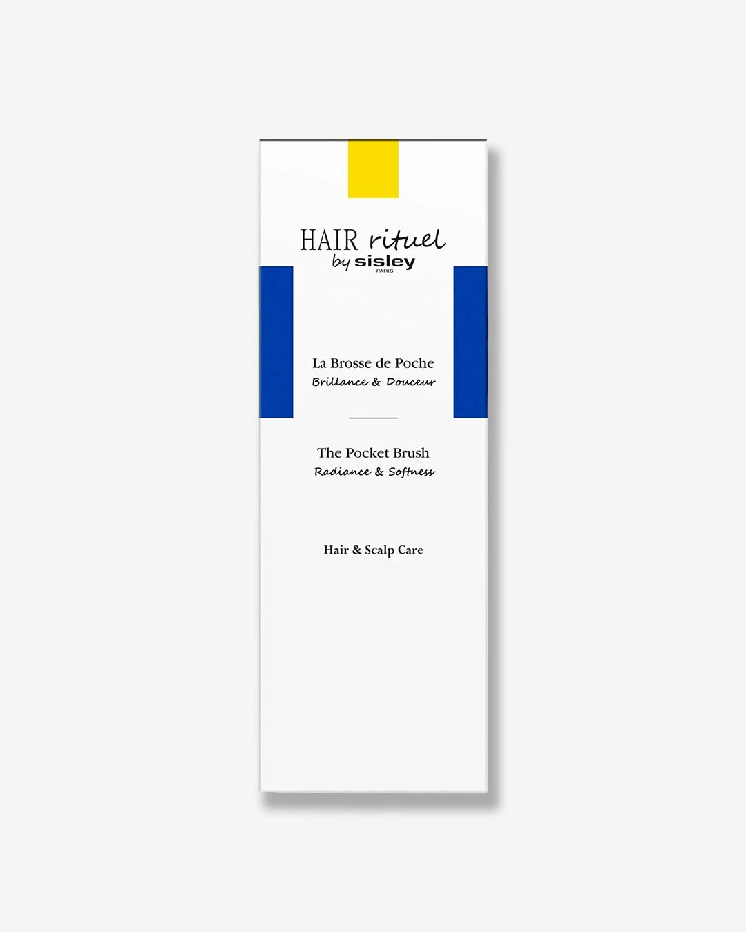 Hairbrush packaging with 'Hair rituel by Sisley The Pocket Brush' branding on a white background