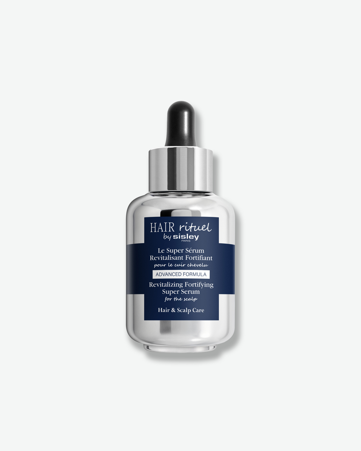 A glass dropper bottle of Hair Rituel by Sisley Revitalizing Fortifying Super Serum, featuring a metallic finish and navy blue label centered against a white background.