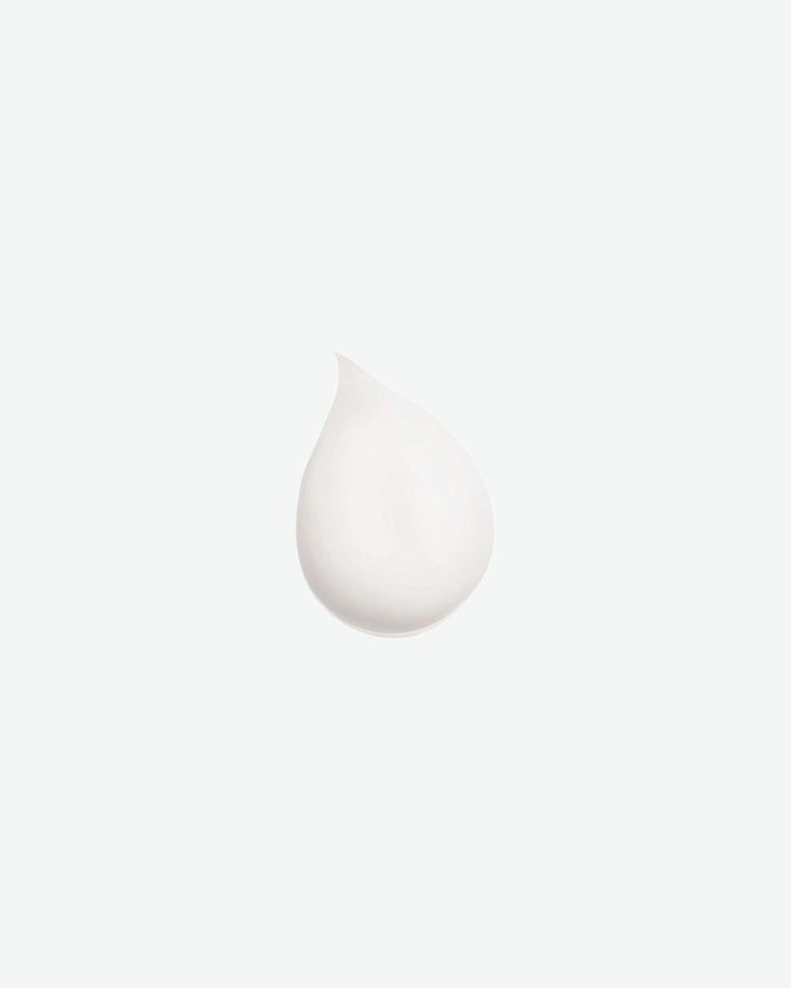 White cream droplet on a white background