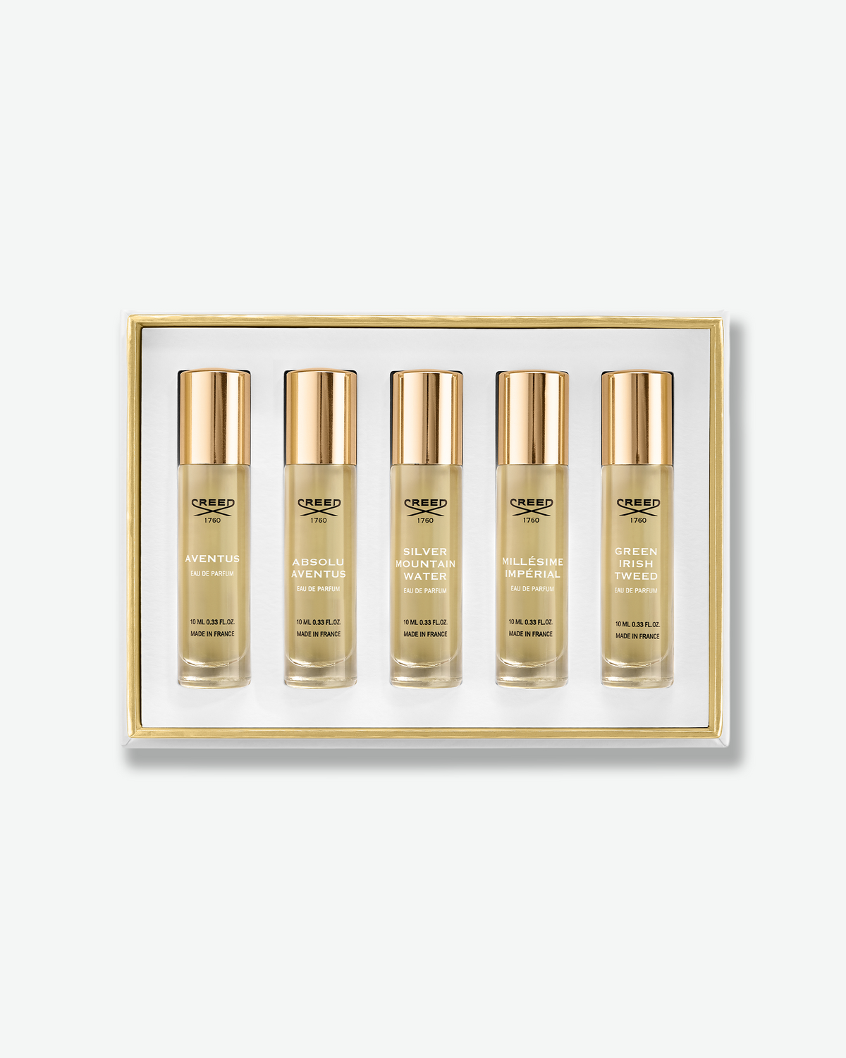 Creed Fragrance Discovery Set featuring five 10 mL eau de parfum sprays: Aventus, Absolu Aventus, Silver Mountain Water, Millésime Impérial, and Green Irish Tweed, displayed in a gold-trimmed presentation box.