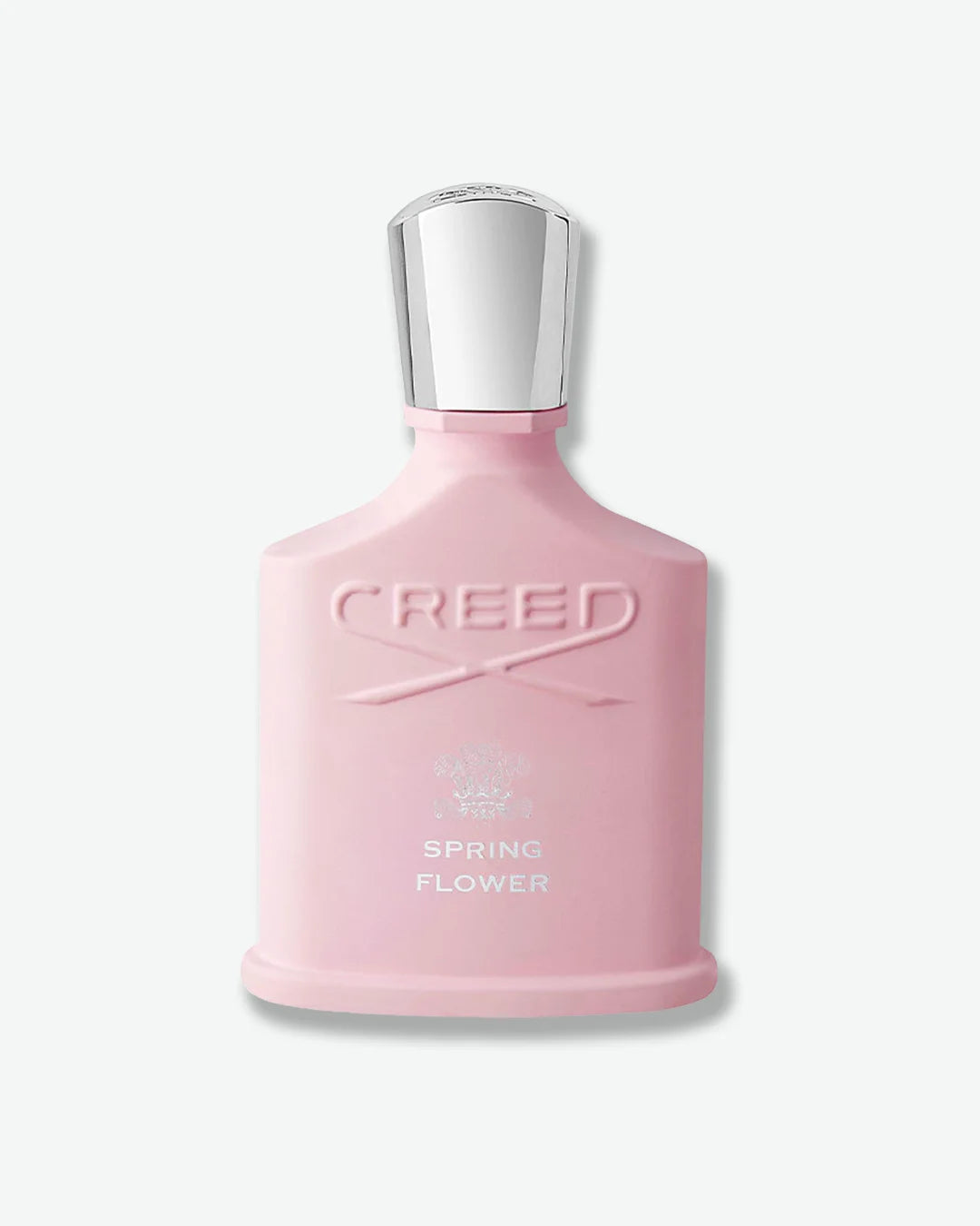 Pink Creed Spring Flower perfume bottle with silver cap on a white background
