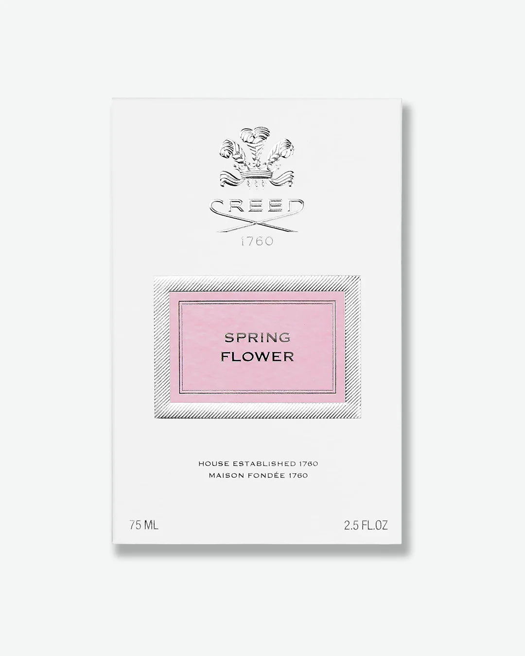 White perfume bottle packaging with silver 'Creed' logo and 'Spring Flower' text on a pink label on a white background