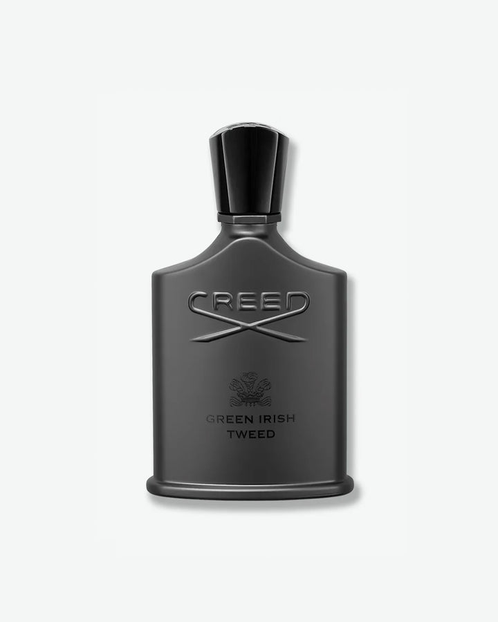 Creed Green Irish Tweed Fragrance in a signature silhouette matte black bottle featuring an embossed logo and a matching black cap, isolated on a light grey background.