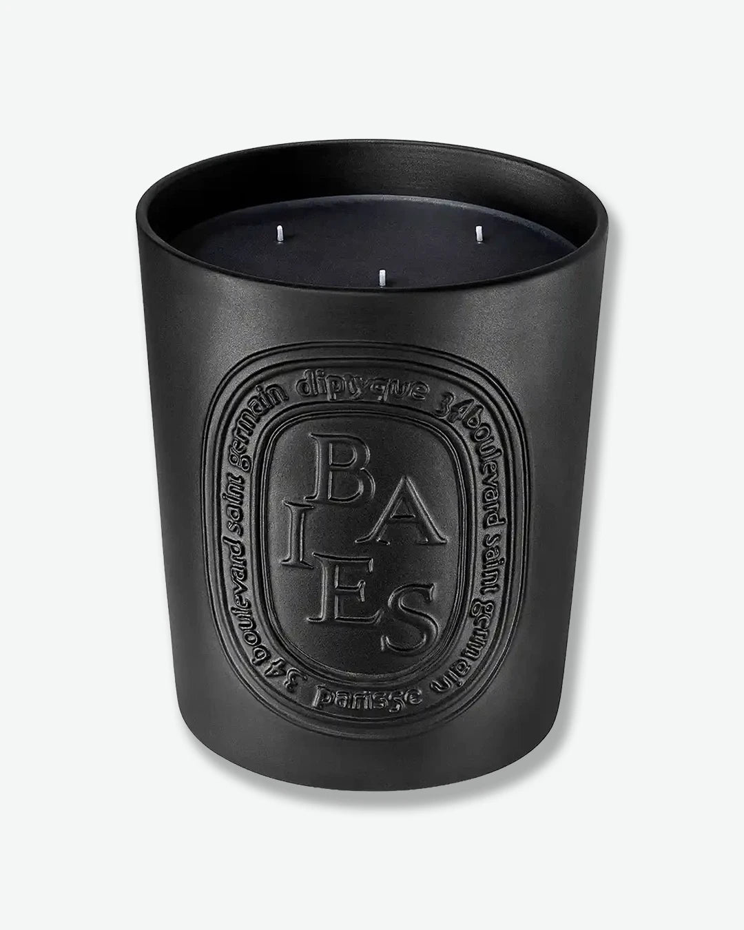 Black candle with 'BAIES' branding on a white background