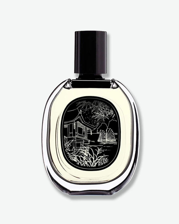 Perfume bottle with artistic design on a white background