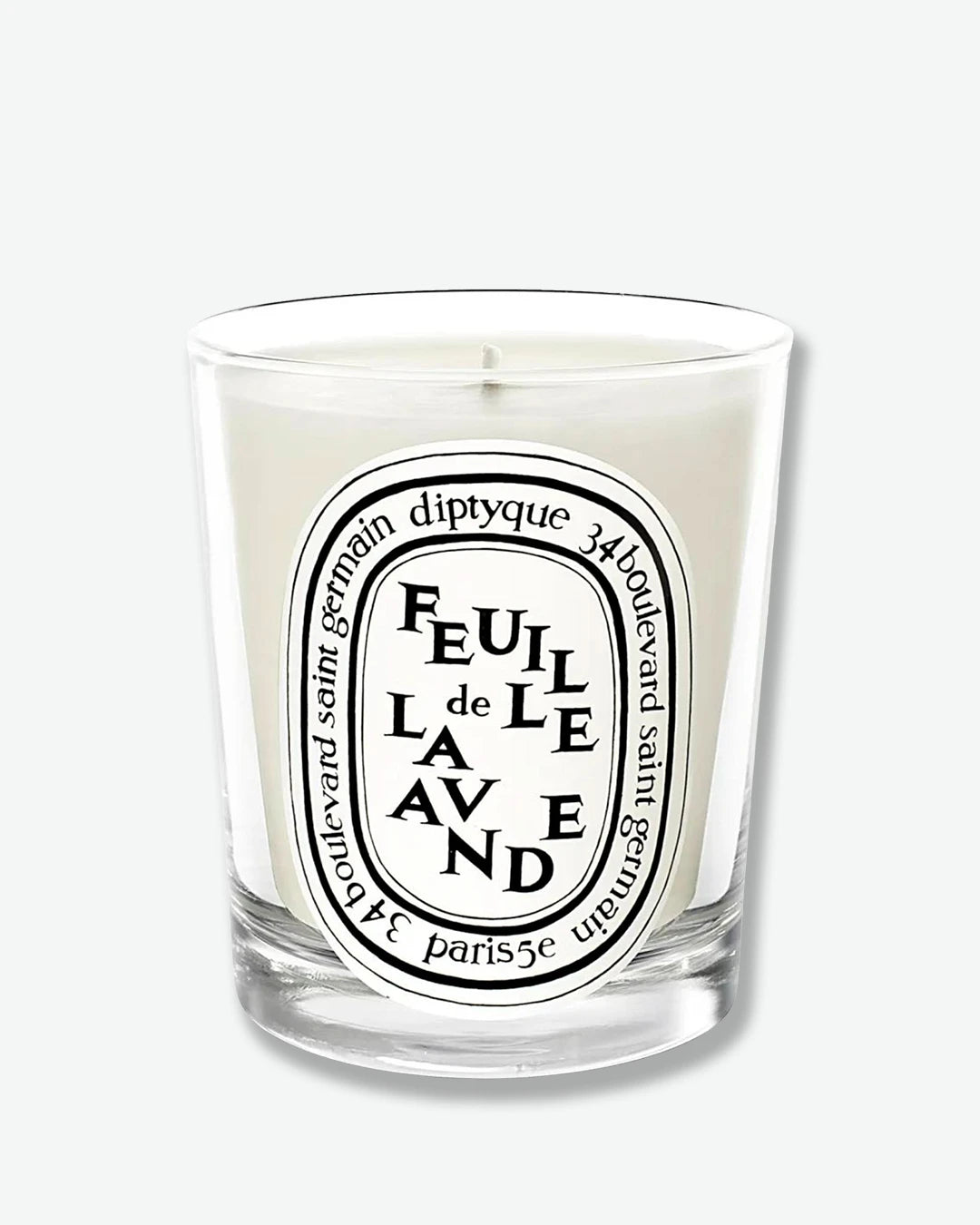 Diptyque candle with a white label on a white background